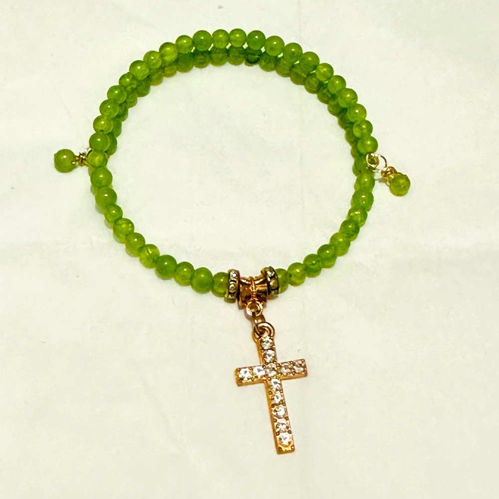 Handmade Green Bracelet with Gold Cross Charm. Made with Memory Gold Wire.